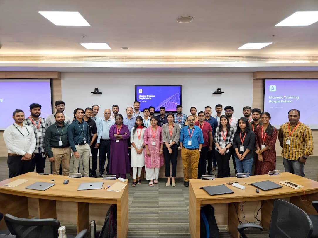 The Maveric and Intellect cohort standing in the classroom at Nxt Lvl, Chennai, in front of screens that read Maveric Training, Purple Fabric